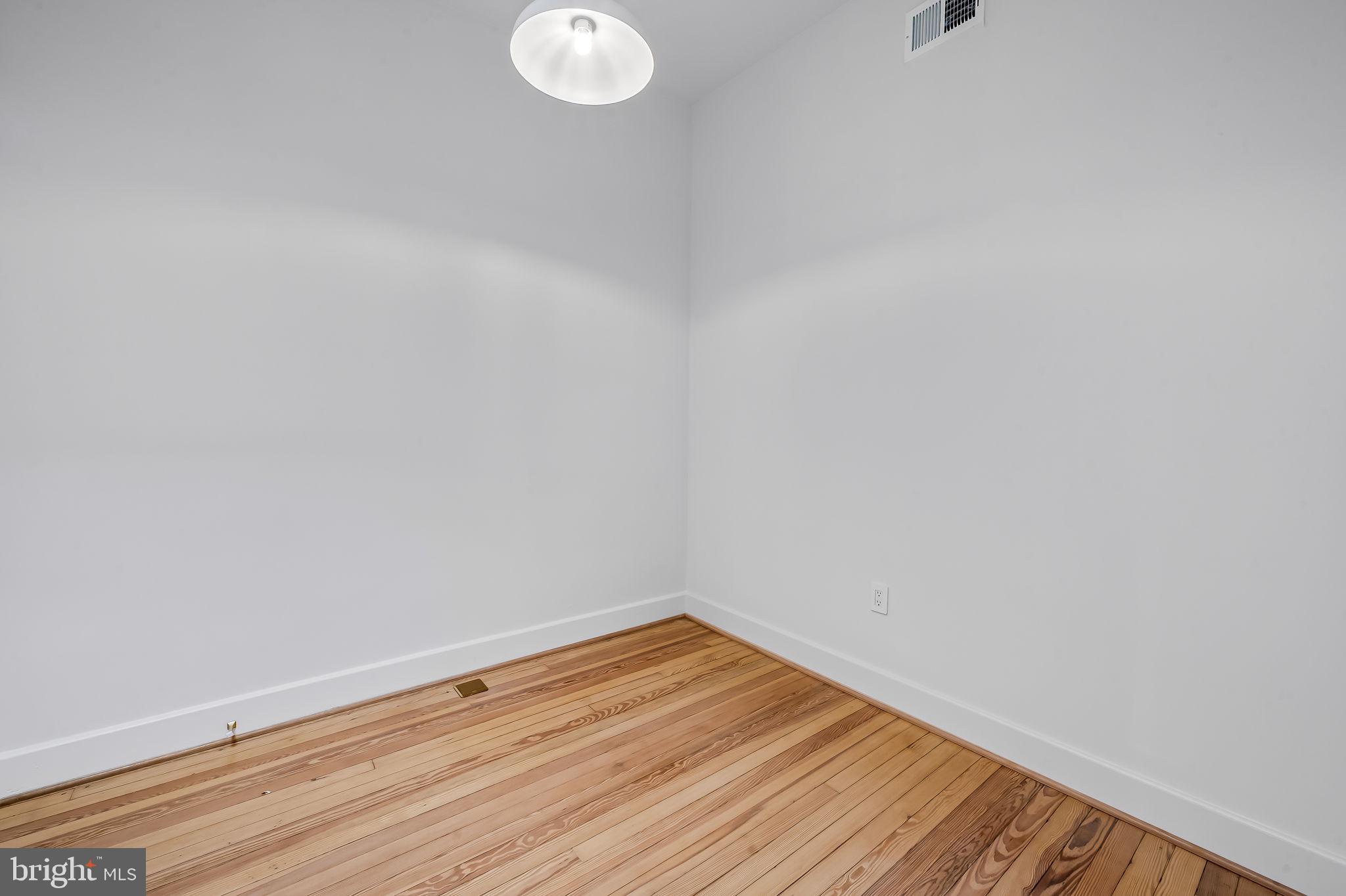 832 Union Avenue Baltimore, MD 21211 - Photo 26 of 43 a view of a room with wooden floor