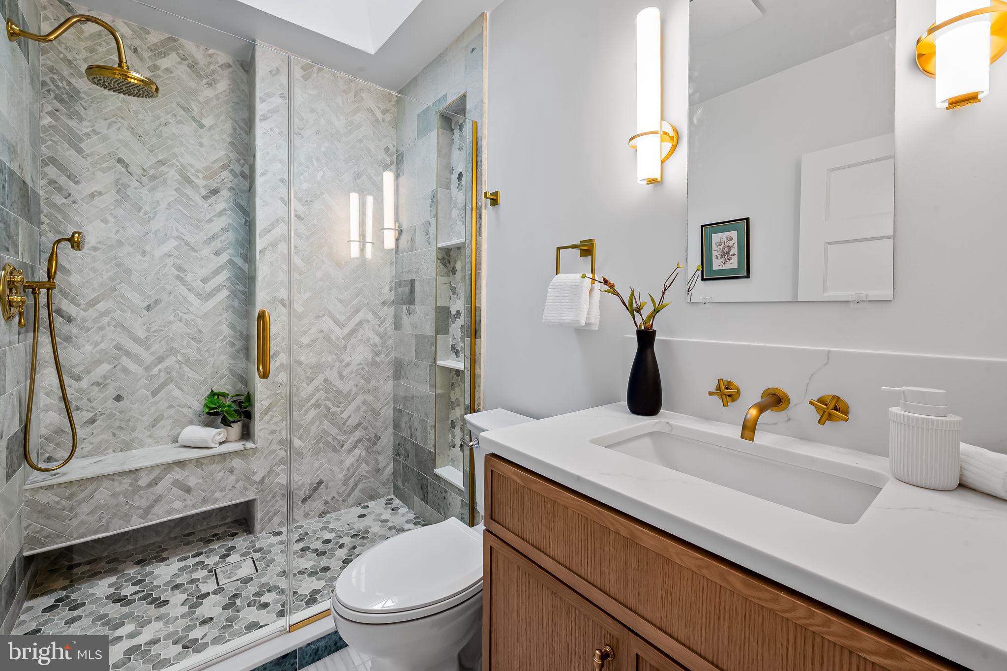 832 Union Avenue Baltimore, MD 21211 - Photo 27 of 43 a bathroom with a sink a toilet and shower