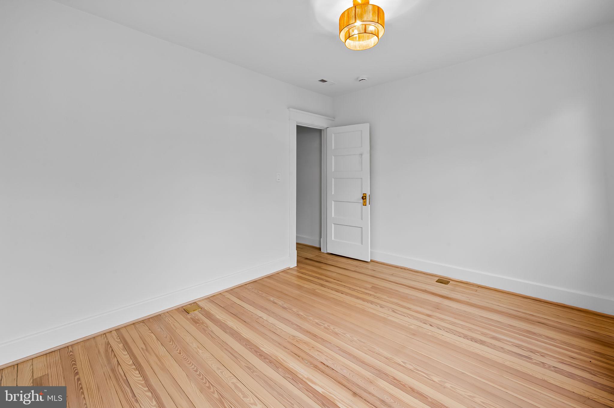 832 Union Avenue Baltimore, MD 21211 - Photo 30 of 43 a view of an empty room and wooden floor
