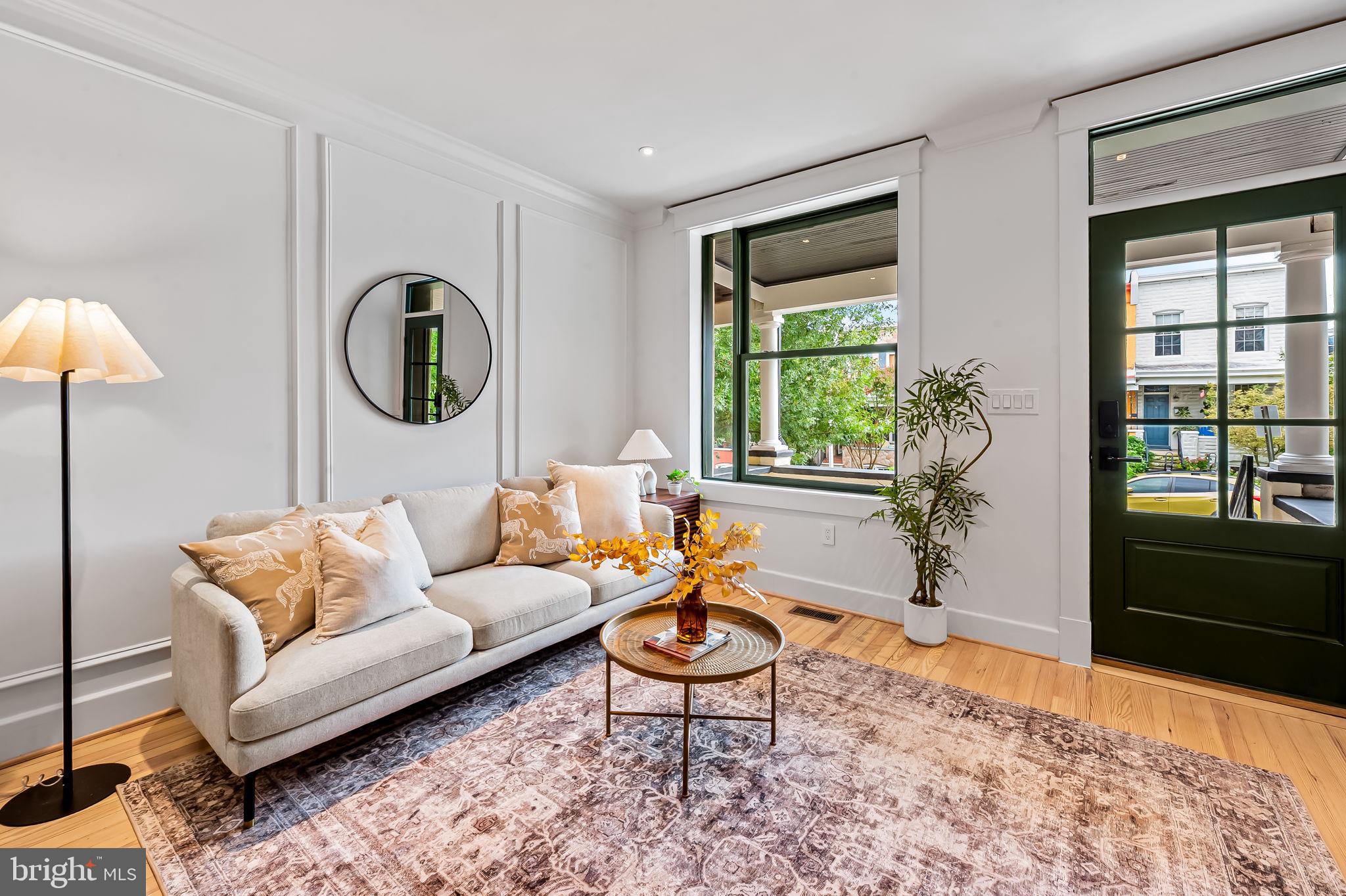 832 Union Avenue Baltimore, MD 21211 - Photo 9 of 43 a living room with furniture and a large window