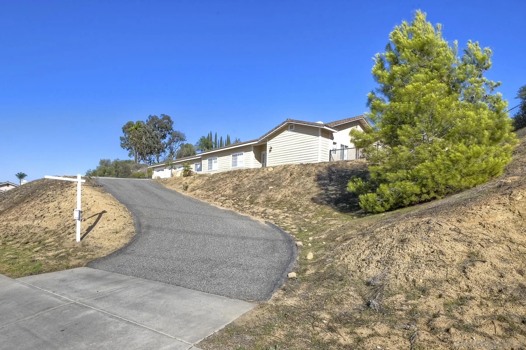 1550 Alturas Road Fallbrook, CA 92028 - Photo 3 of 31 a view of a dry yard with wooden fence
