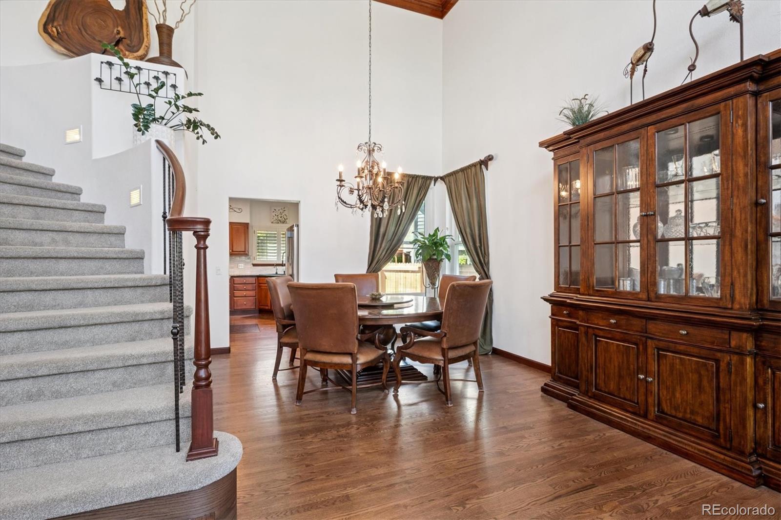 7804 Silverweed Way Lone Tree, CO 80124 - Photo 11 of 32 a view of a dining room with furniture window and wooden floor