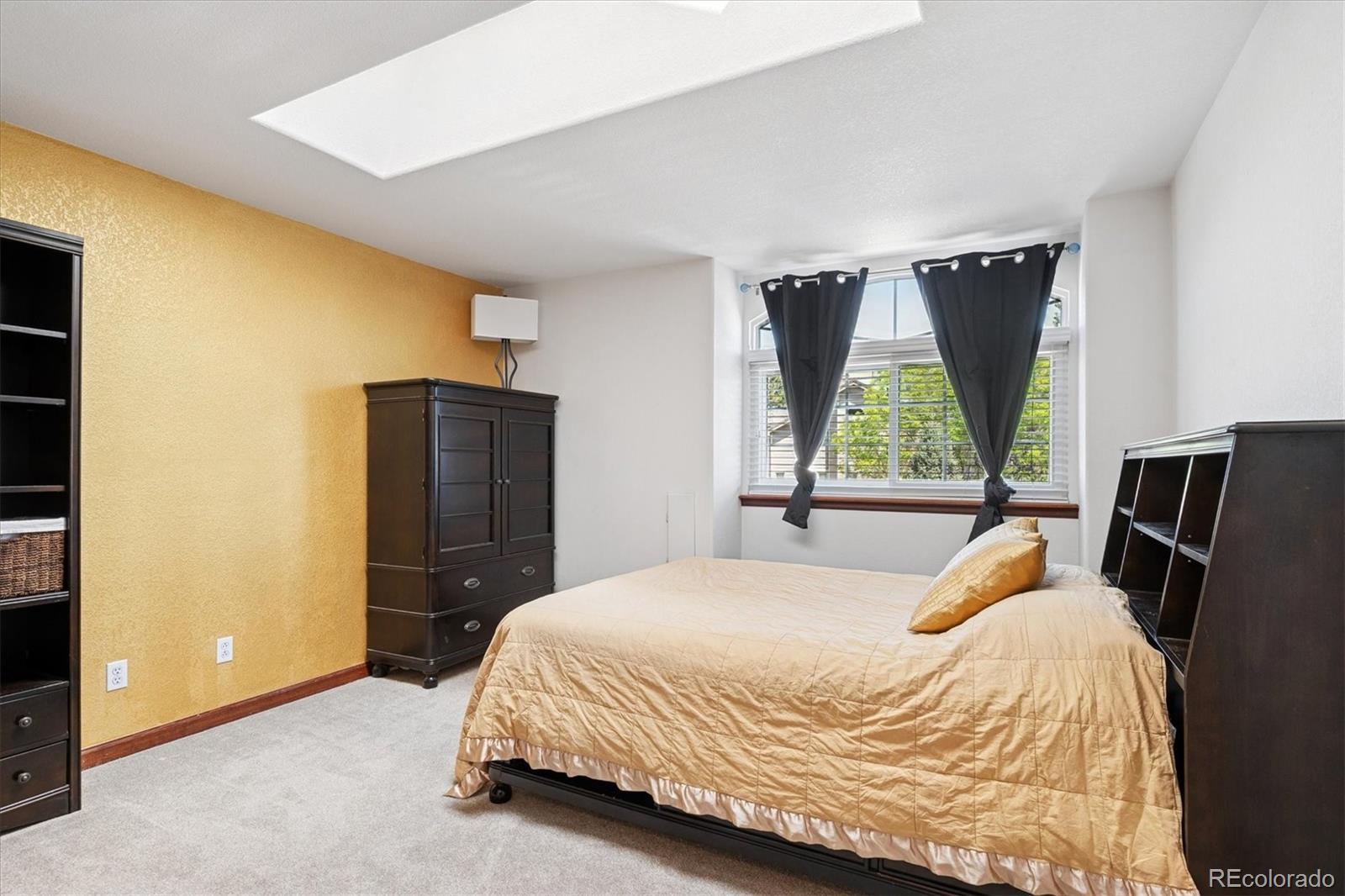 7804 Silverweed Way Lone Tree, CO 80124 - Photo 17 of 32 a bedroom with a bed closet and a window