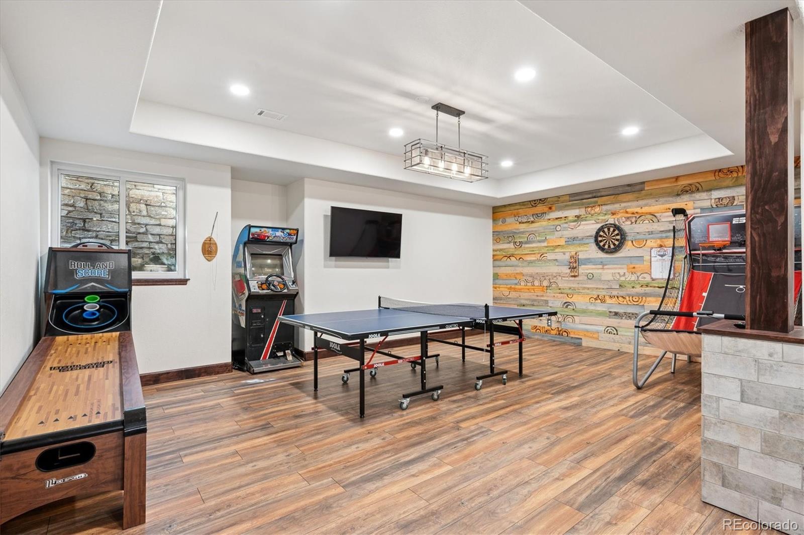 7804 Silverweed Way Lone Tree, CO 80124 - Photo 20 of 32 a living room with furniture and a flat screen tv