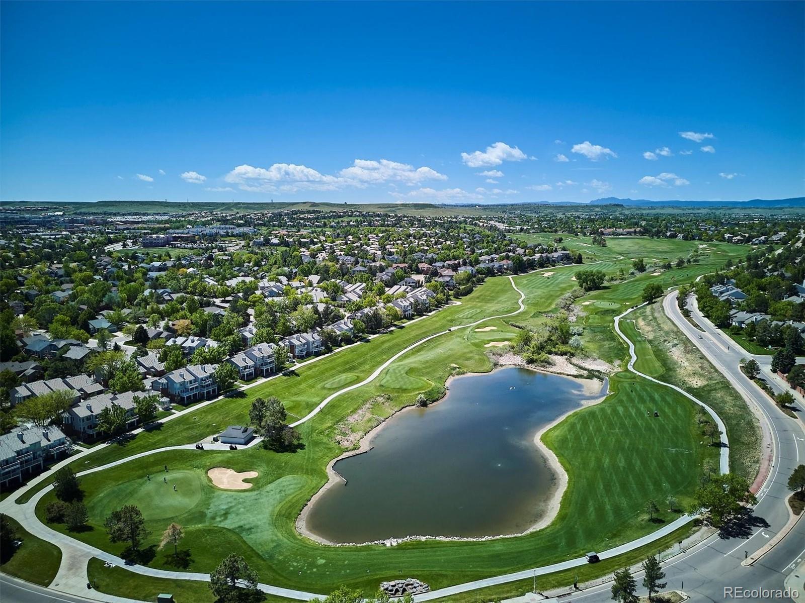 7804 Silverweed Way Lone Tree, CO 80124 - Photo 28 of 32 a view of a swimming pool with a yard and outdoor seating