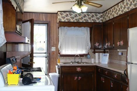 10851 Oak Avenue Chicago Ridge, IL 60415 - Photo 7 of 15 a kitchen with a sink cabinets and a wooden floor