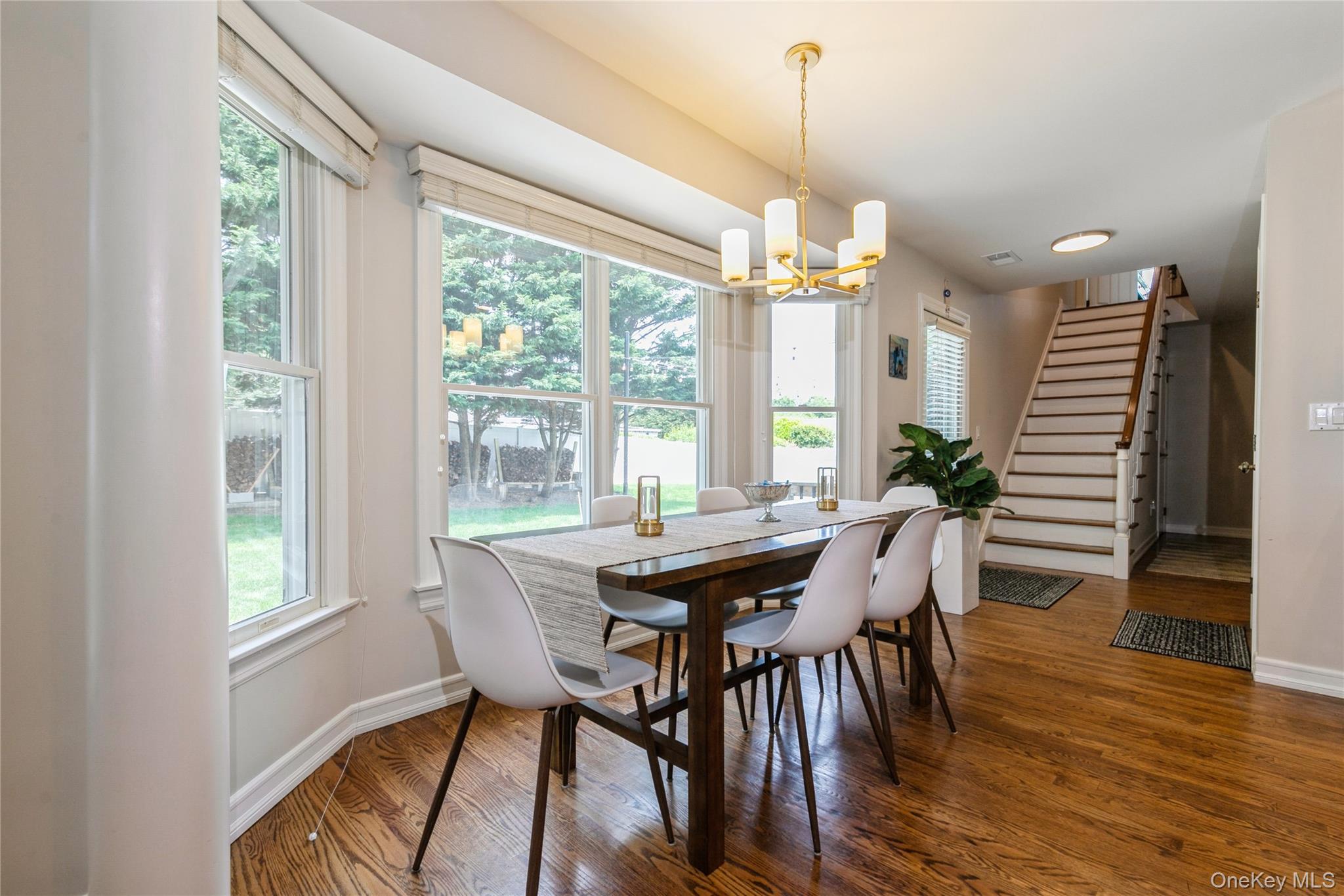 800 Ruth Road Mattituck, NY 11952 - Photo 11 of 29 a view of a dining room with furniture window and wooden floor