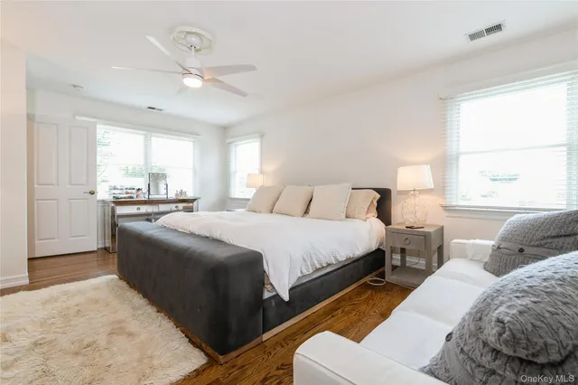 a bedroom with bed and window