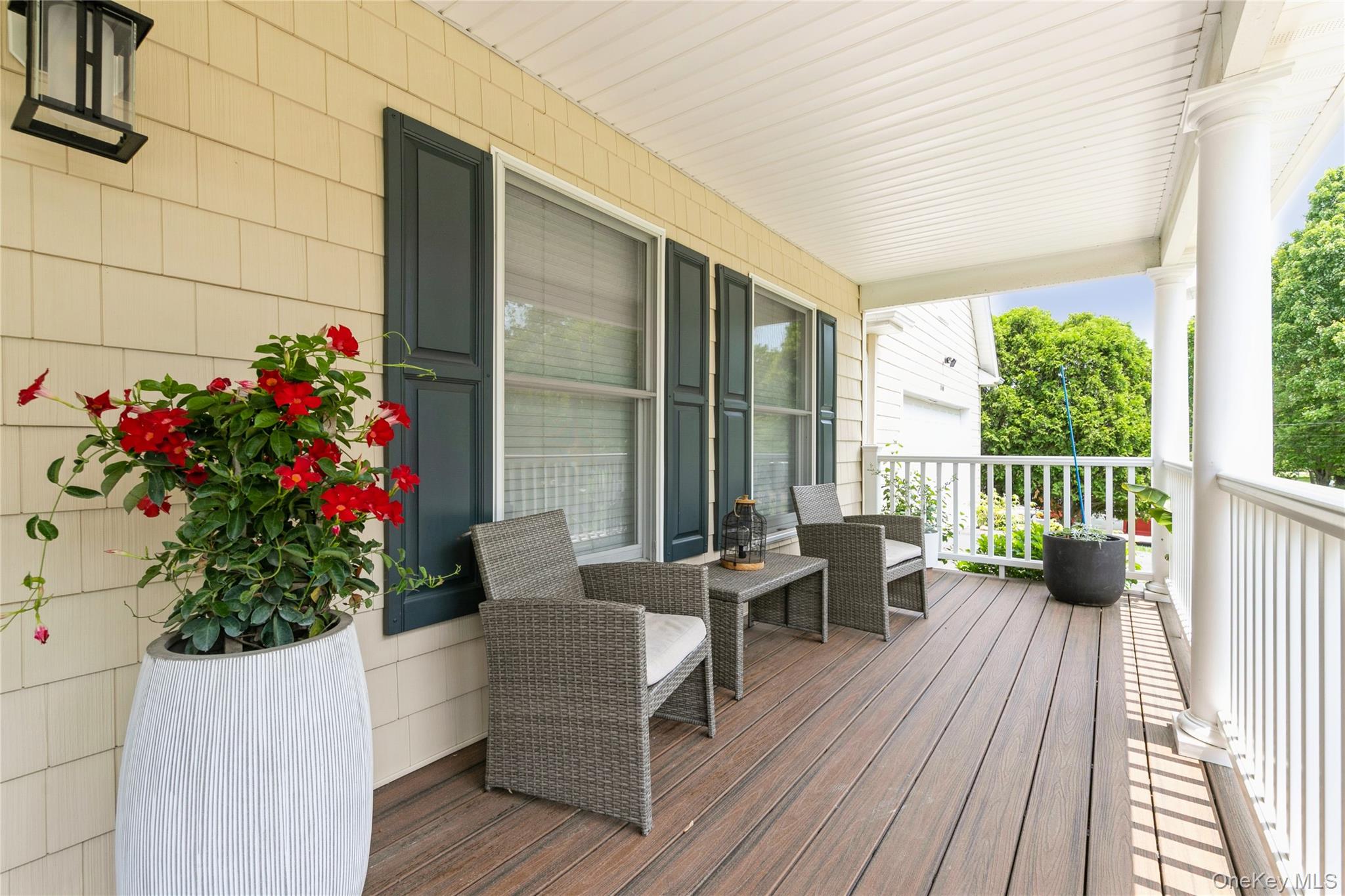 800 Ruth Road Mattituck, NY 11952 - Photo 21 of 29 a balcony with furniture and flowers