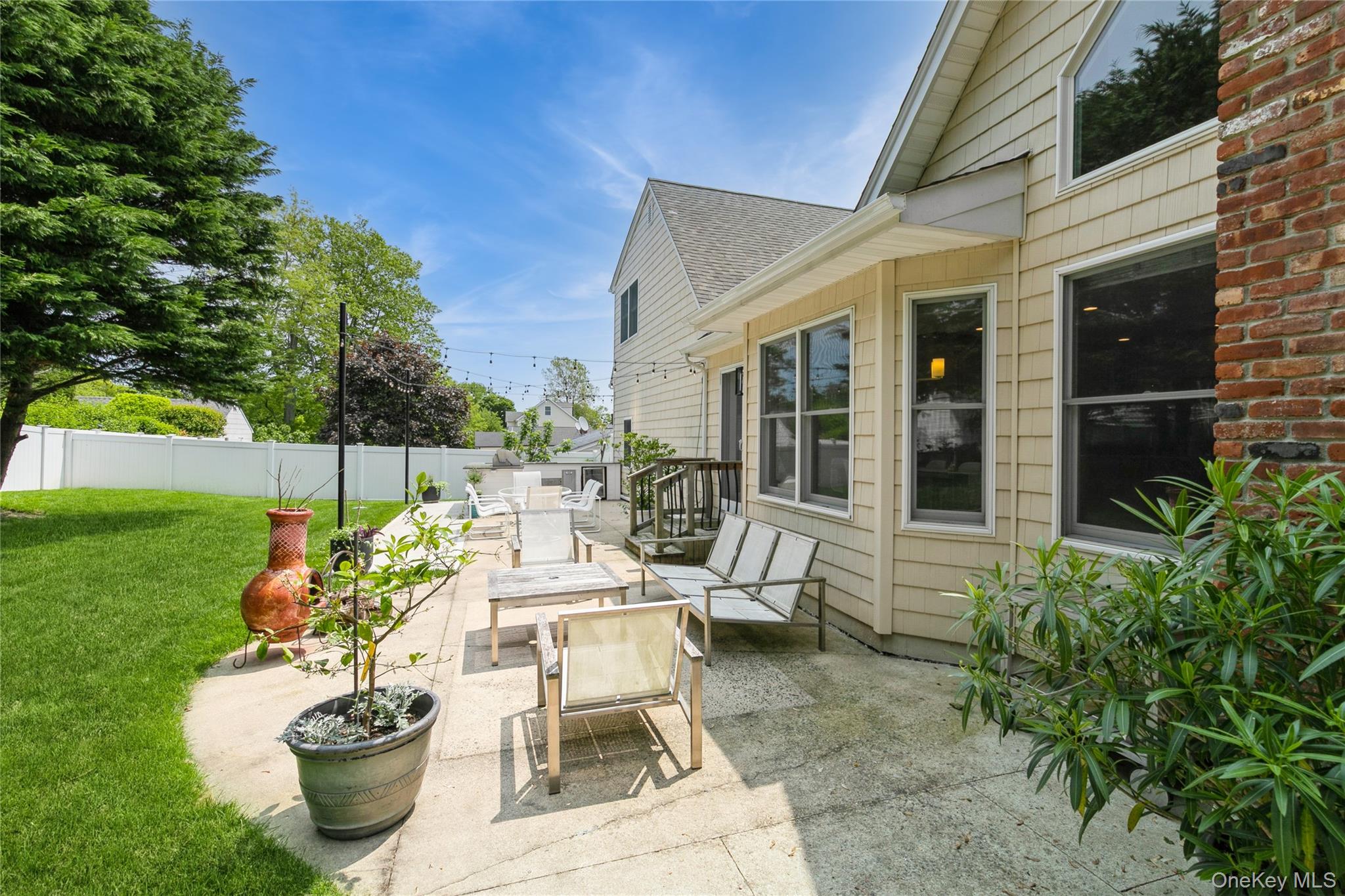 800 Ruth Road Mattituck, NY 11952 - Photo 26 of 29 a view of a patio with plants and chairs