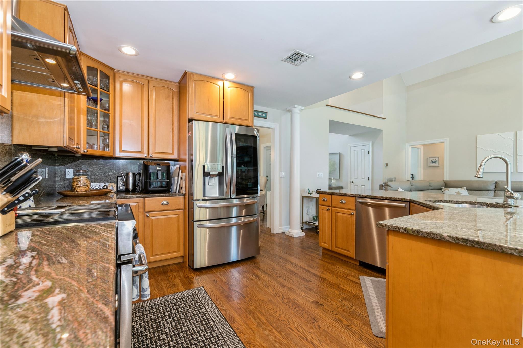 800 Ruth Road Mattituck, NY 11952 - Photo 9 of 29 a kitchen with granite countertop a refrigerator stove top oven and sink