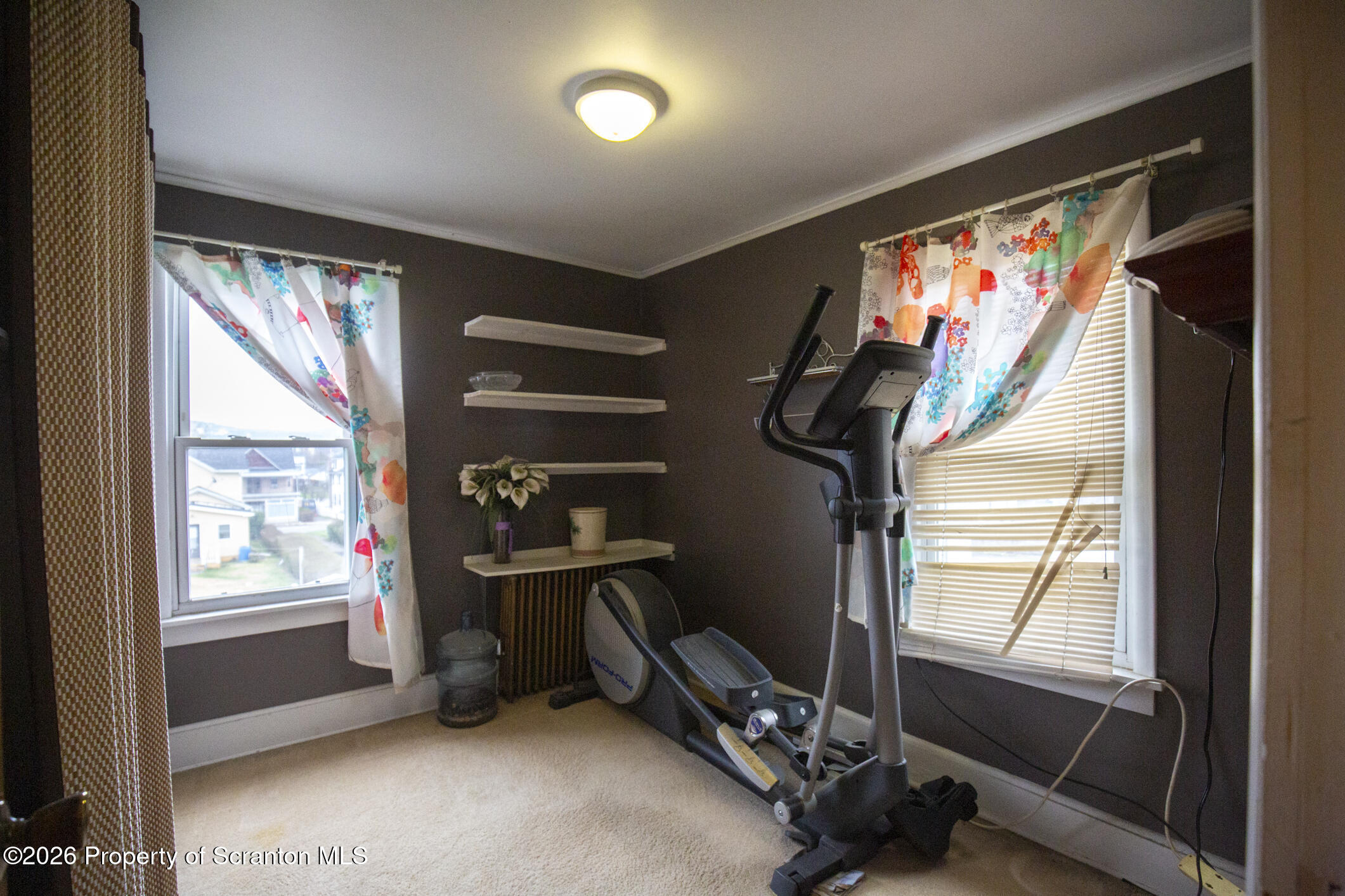 3245 Cedar Avenue Scranton, PA 18505 - Photo 26 of 37 a room with gym equipment and a large window