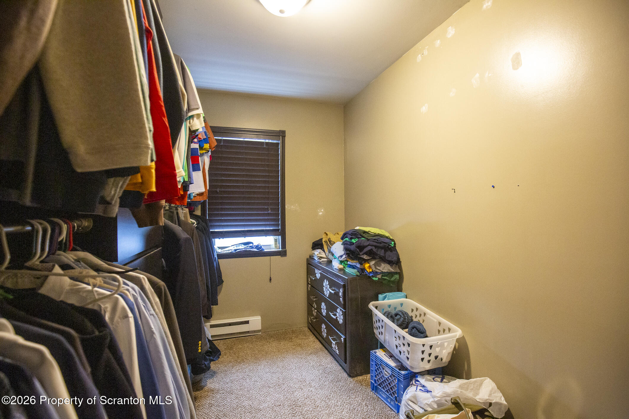 3245 Cedar Avenue Scranton, PA 18505 - Photo 33 of 37 a bedroom with a bed and a chandelier