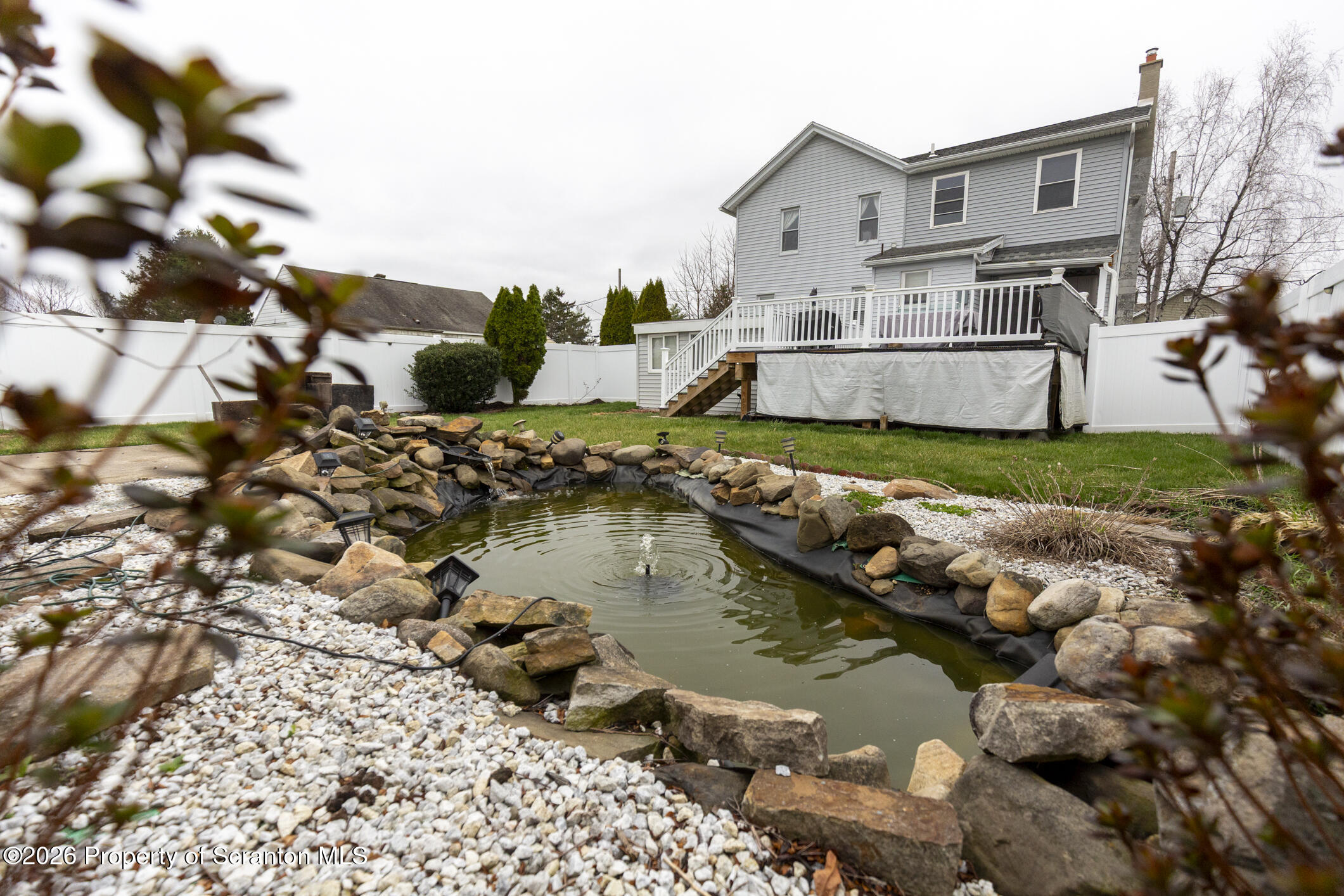 3245 Cedar Avenue Scranton, PA 18505 - Photo 8 of 37 a view of a house with a yard and a pond