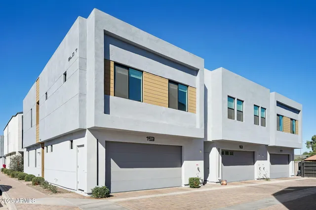 a front view of a building with garage