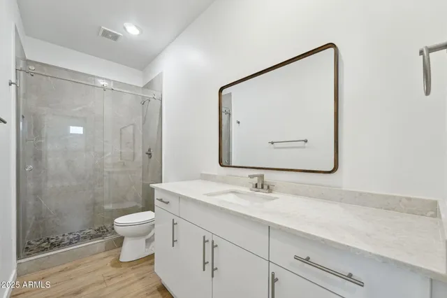 a bathroom with a double vanity sink and mirror