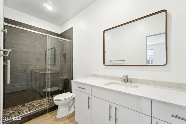 a bathroom with a tub sink and mirror