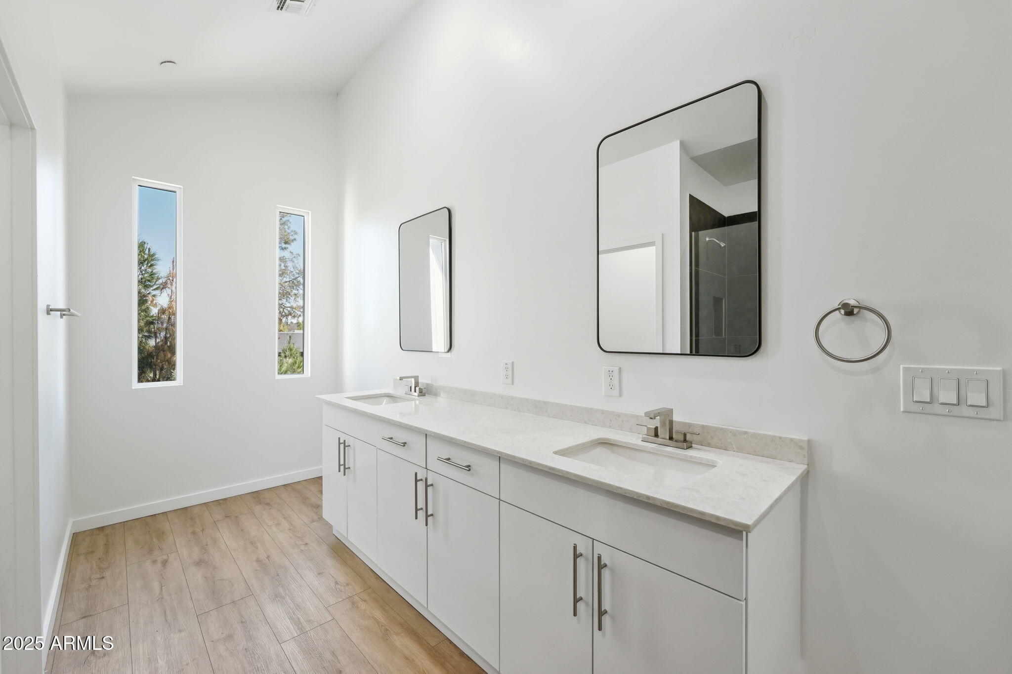 225 North Pleasant Drive, Unit 30 Chandler, AZ 85225 - Photo 24 of 34 a bathroom with 2 sink and a mirror