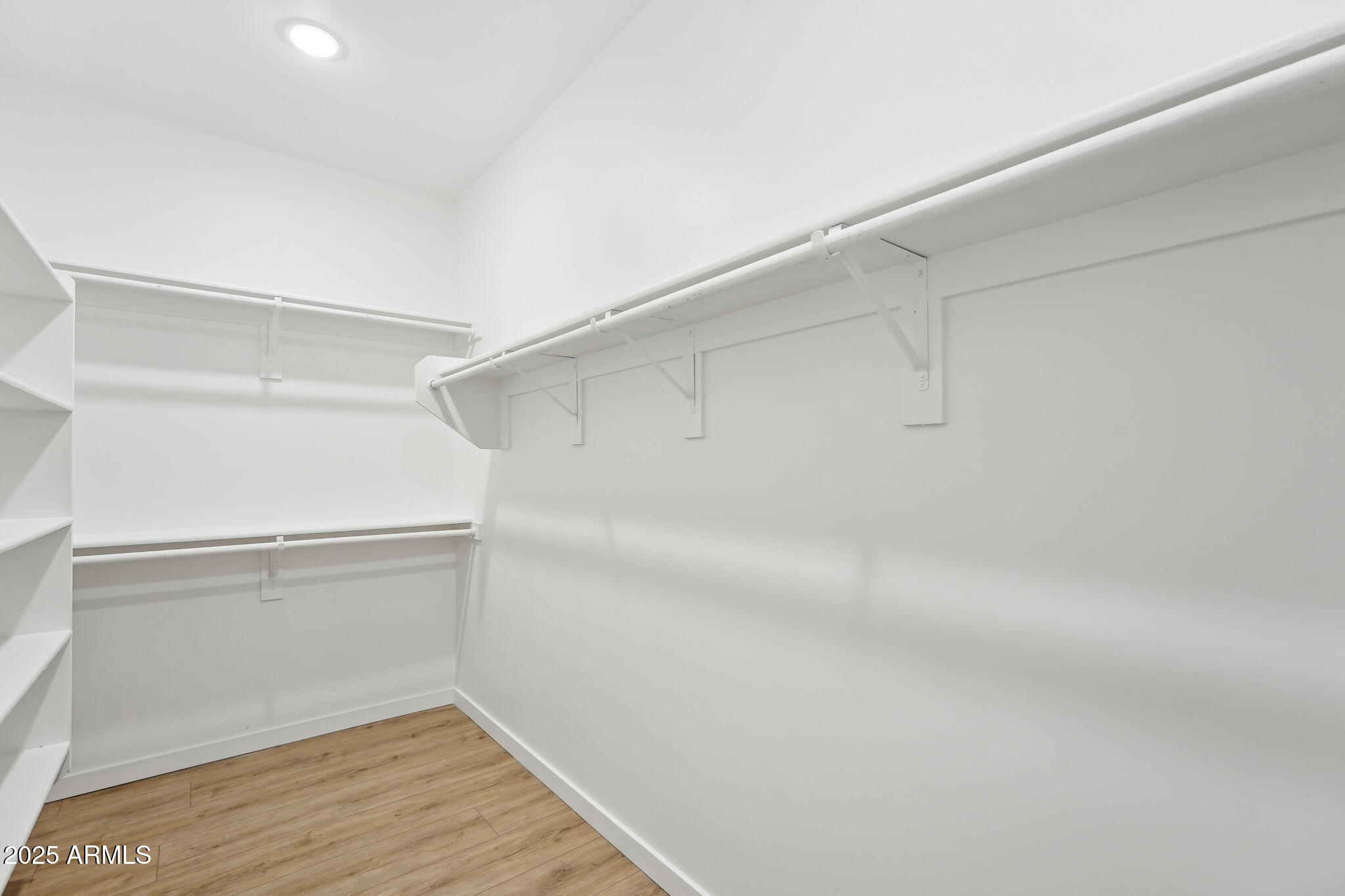 225 North Pleasant Drive, Unit 30 Chandler, AZ 85225 - Photo 29 of 34 a view of an empty walk in closet