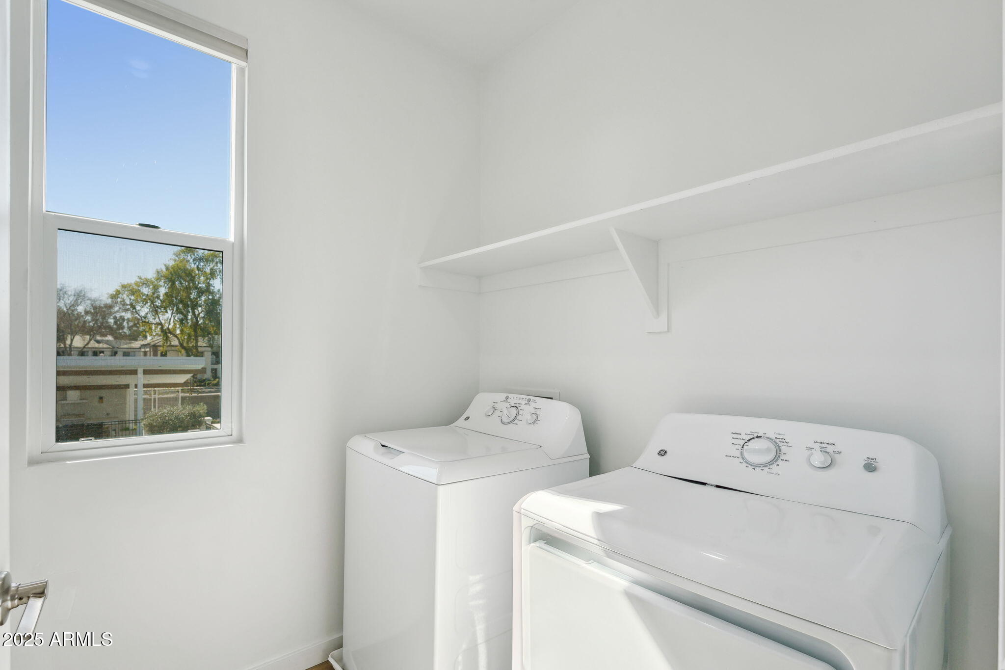 225 North Pleasant Drive, Unit 30 Chandler, AZ 85225 - Photo 31 of 34 a utility room with dryer and washer