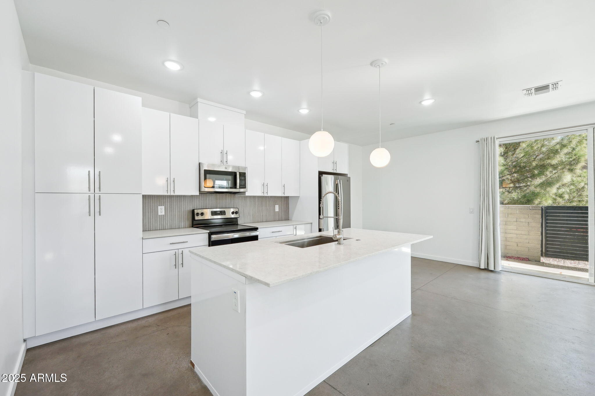 225 North Pleasant Drive, Unit 30 Chandler, AZ 85225 - Photo 7 of 34 a kitchen with a sink a stove and refrigerator