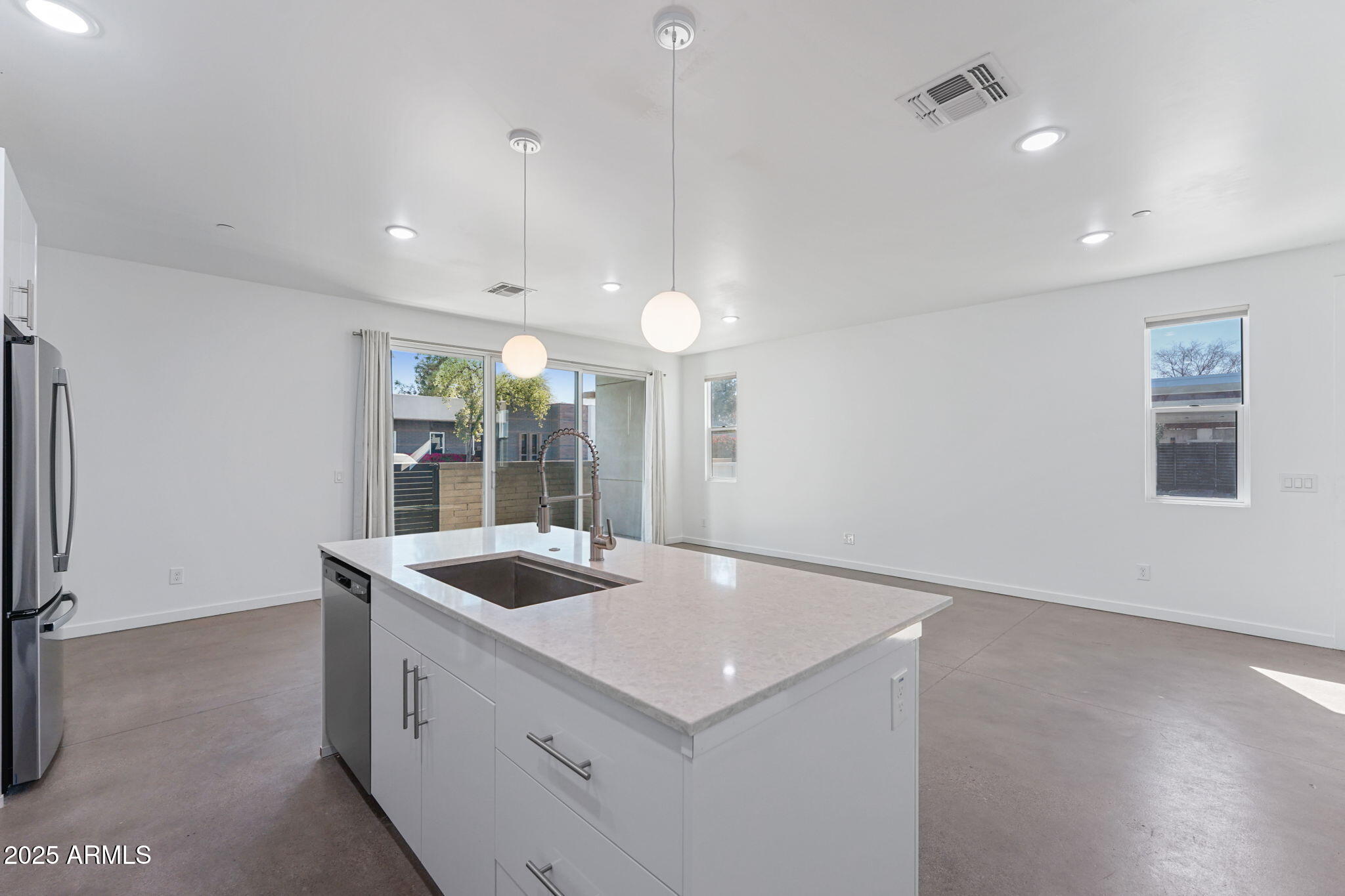 225 North Pleasant Drive, Unit 30 Chandler, AZ 85225 - Photo 8 of 34 a kitchen with a sink dishwasher and a refrigerator with wooden floor
