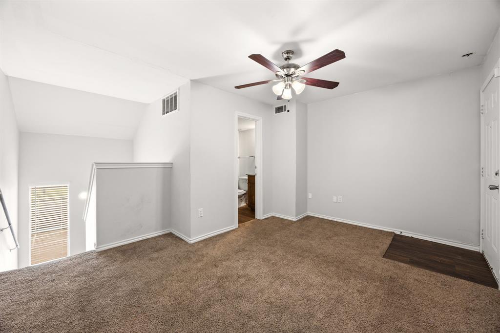 9837 Walnut Street, Unit S203 Dallas, TX 75243 - Photo 19 of 26 Spacious room with carpeting, a ceiling fan with light, and access to a bathroom