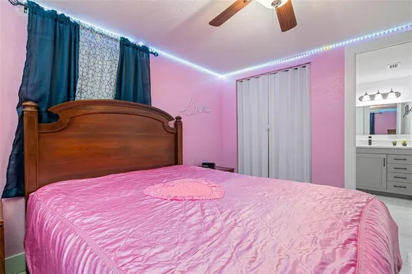 a bedroom with a bed and closet