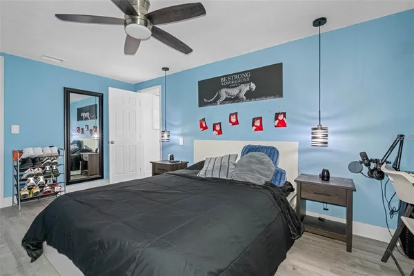 a bedroom with a bed and a dresser