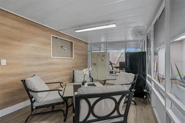 a dining room with furniture and wooden floor