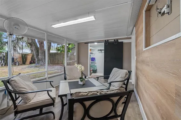 a dining room with furniture and window
