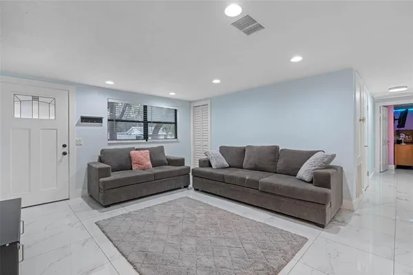 a living room with a couch and a couch