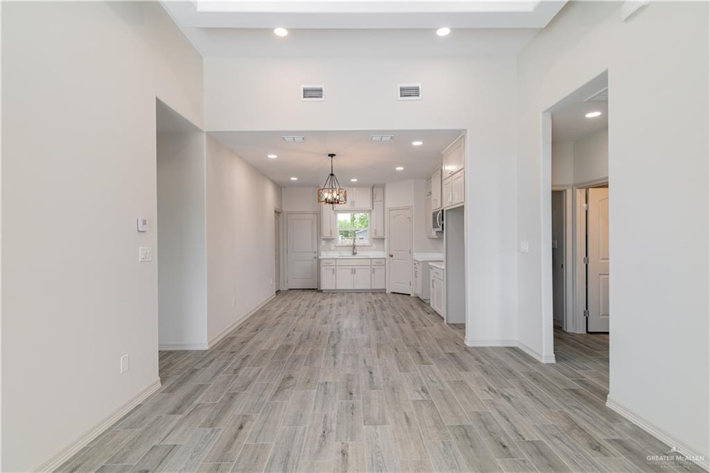 2118 Trinity Street Donna, TX 78537 - Photo 2 of 13 a view of a hallway with wooden floor