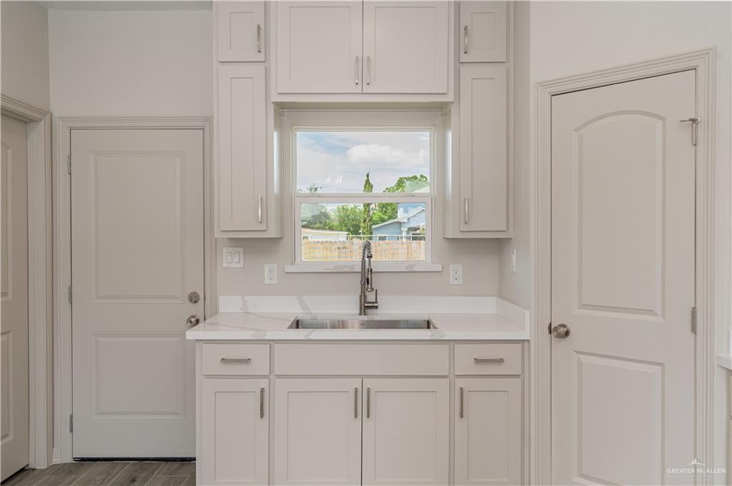 2118 Trinity Street Donna, TX 78537 - Photo 5 of 13 a sink with a mirror