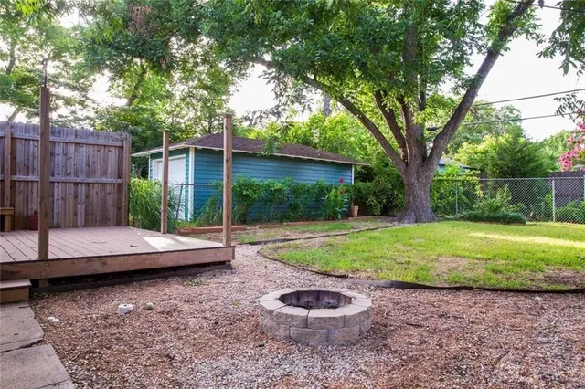 a view of a backyard with plants and a patio