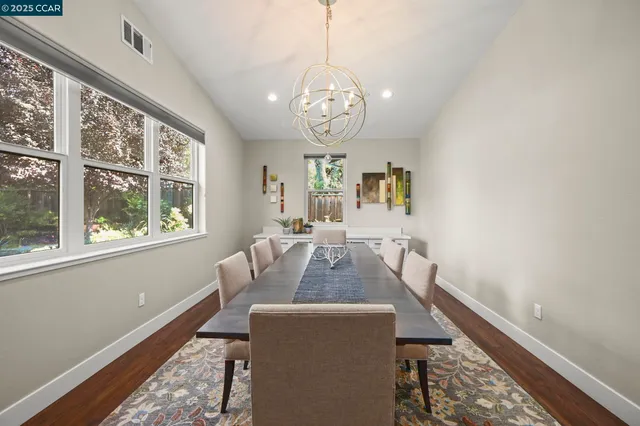 a kitchen with granite countertop a sink stainless steel appliances and cabinets