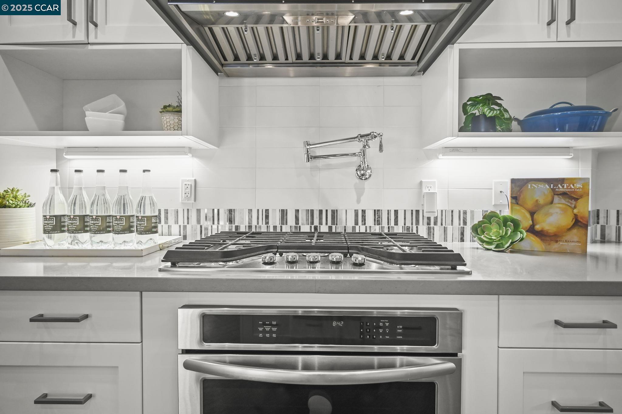 1096 Mountain View Boulevard Walnut Creek, CA 94596 - Photo 16 of 49 a stove top oven sitting inside of a kitchen