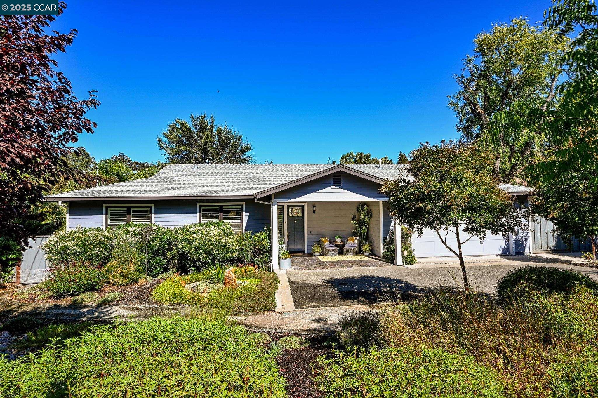 1096 Mountain View Boulevard Walnut Creek, CA 94596 - Photo 2 of 49 a front view of a house with a yard