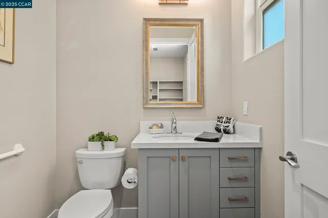 a view of a workspace with furniture and window