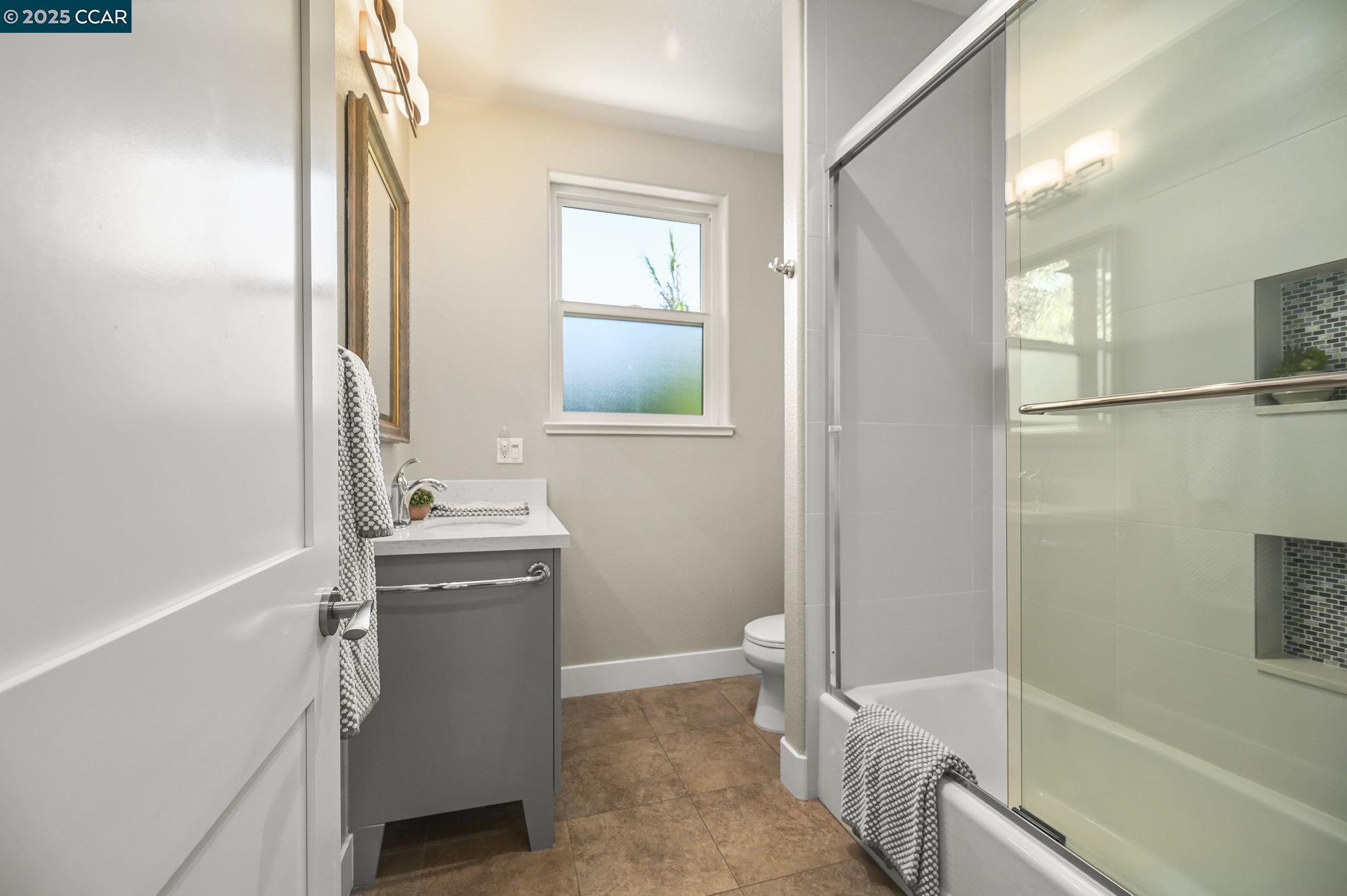 1096 Mountain View Boulevard Walnut Creek, CA 94596 - Photo 25 of 49 a bathroom with a sink a toilet and shower
