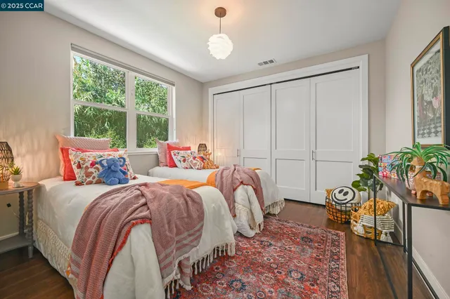 a living room with furniture a flat screen tv and a large window