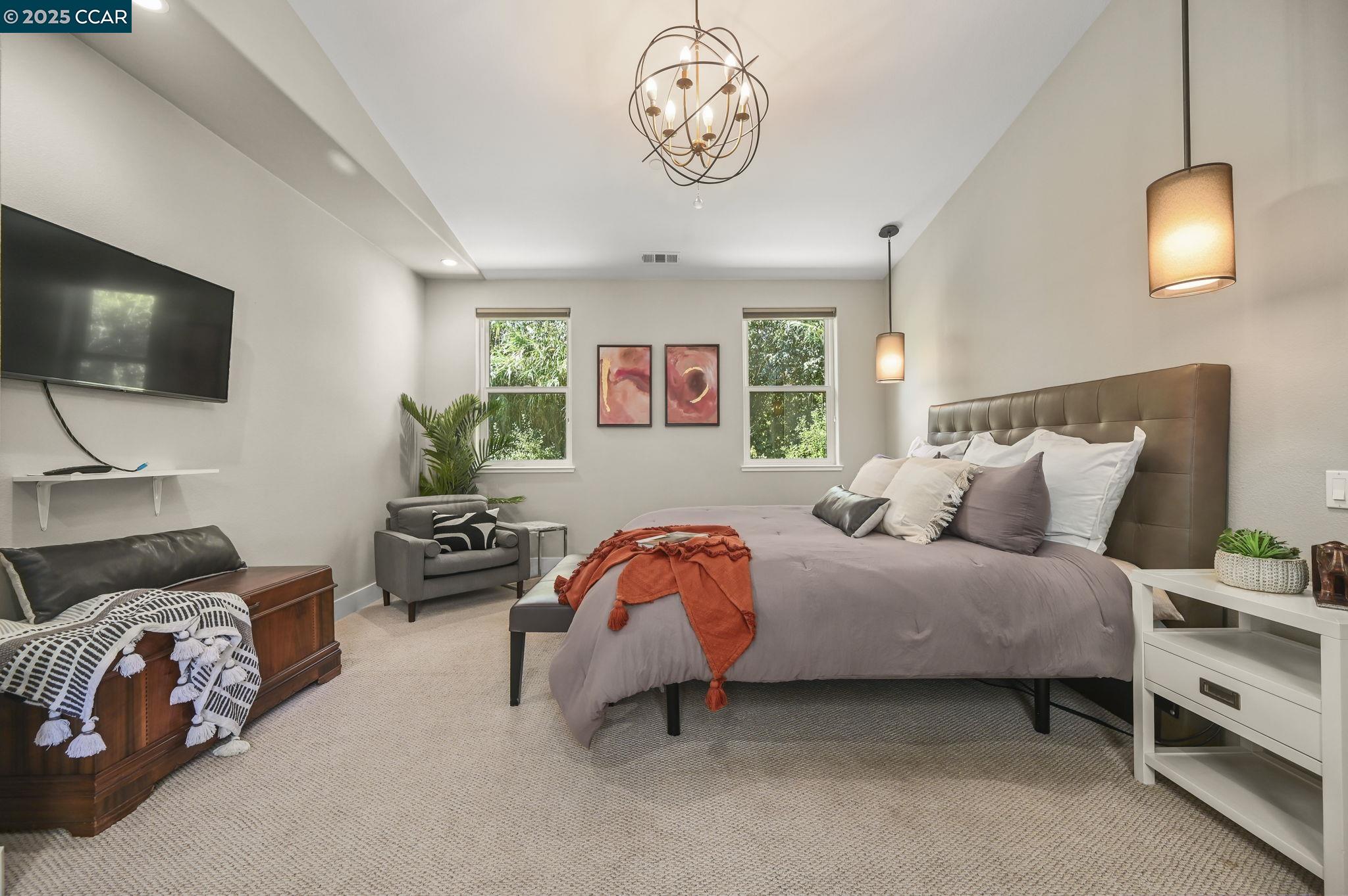 1096 Mountain View Boulevard Walnut Creek, CA 94596 - Photo 27 of 49 a bedroom with bed and a flat screen tv