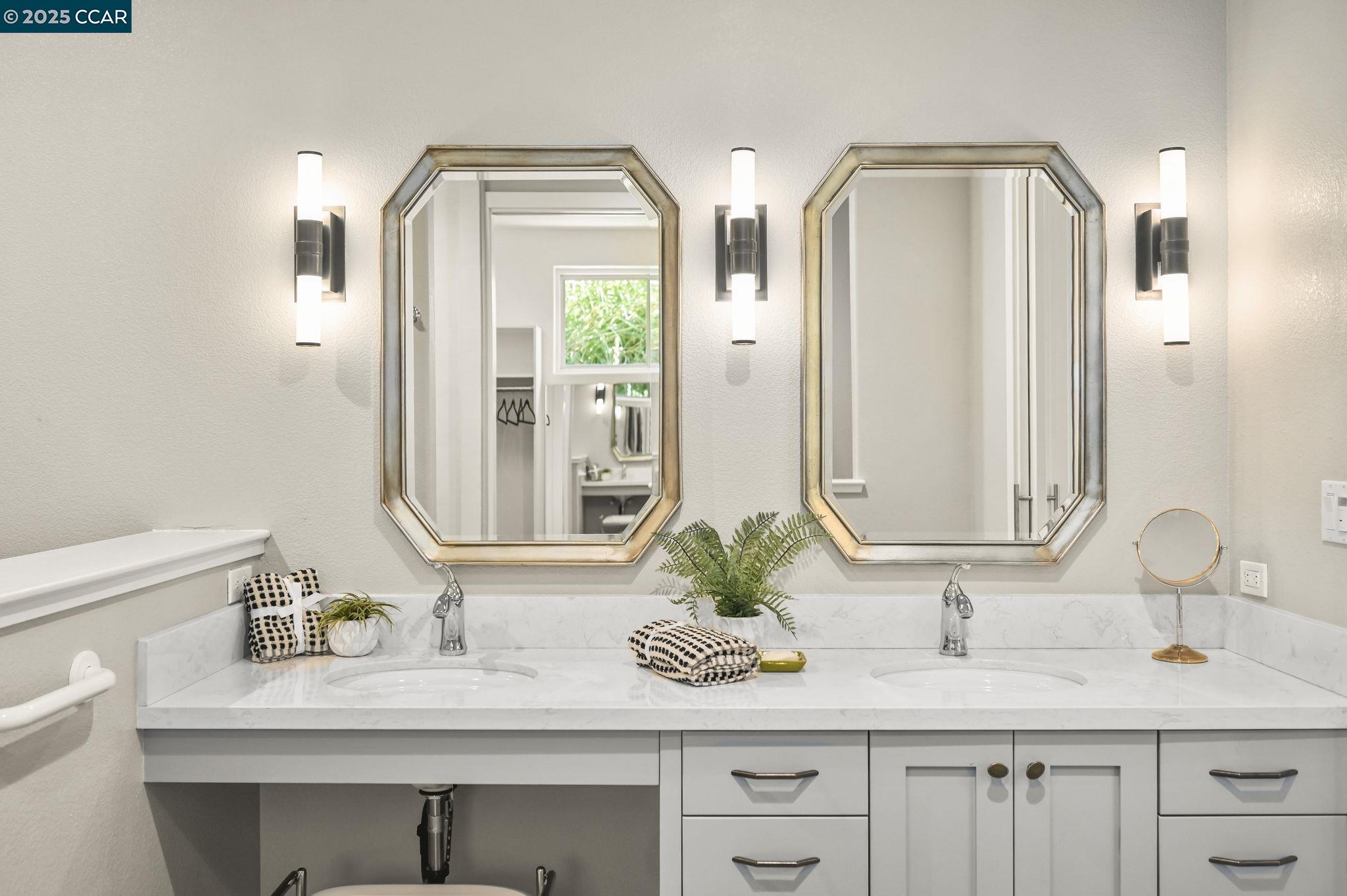 1096 Mountain View Boulevard Walnut Creek, CA 94596 - Photo 30 of 49 a bathroom with double vanity sinks and a mirror