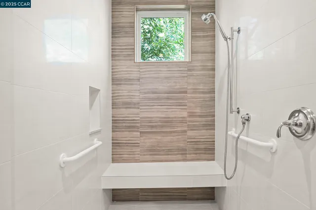 a front view of a house with garden and porch