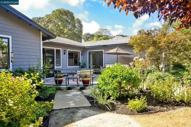 a view of a chairs and table in the patio