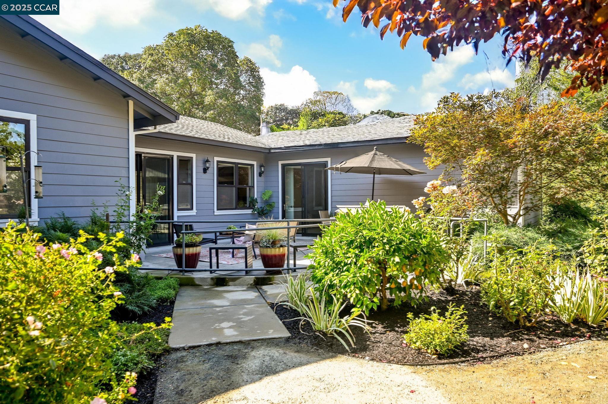 1096 Mountain View Boulevard Walnut Creek, CA 94596 - Photo 33 of 49 a front view of a house with garden and porch