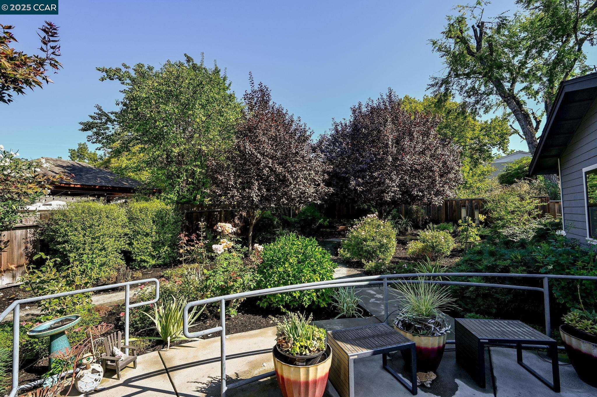 1096 Mountain View Boulevard Walnut Creek, CA 94596 - Photo 37 of 49 a balcony with wooden floor and trees