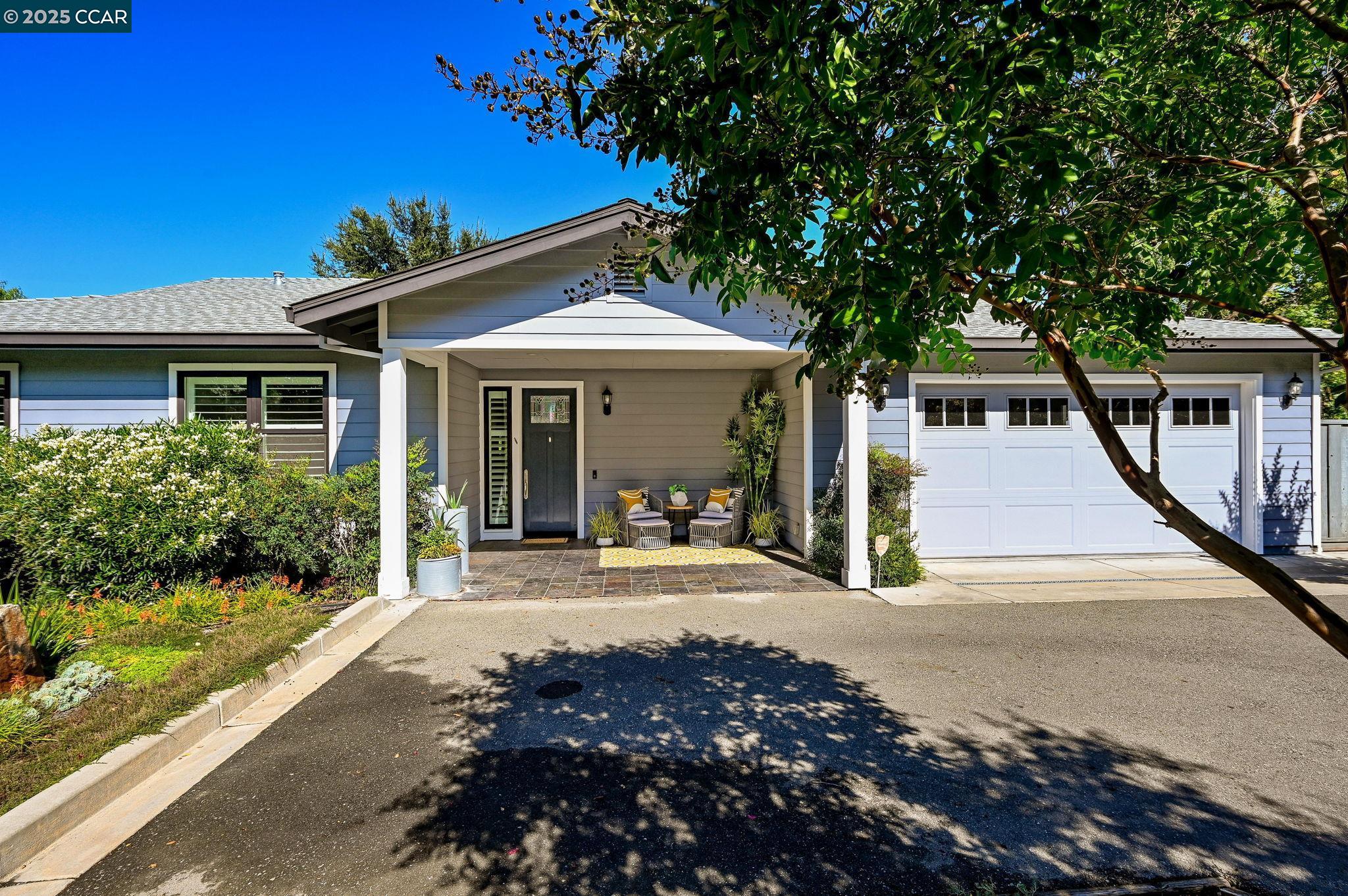 1096 Mountain View Boulevard Walnut Creek, CA 94596 - Photo 4 of 49 a front view of a house with garden