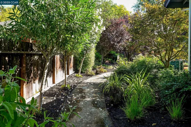 a view of backyard with sitting area