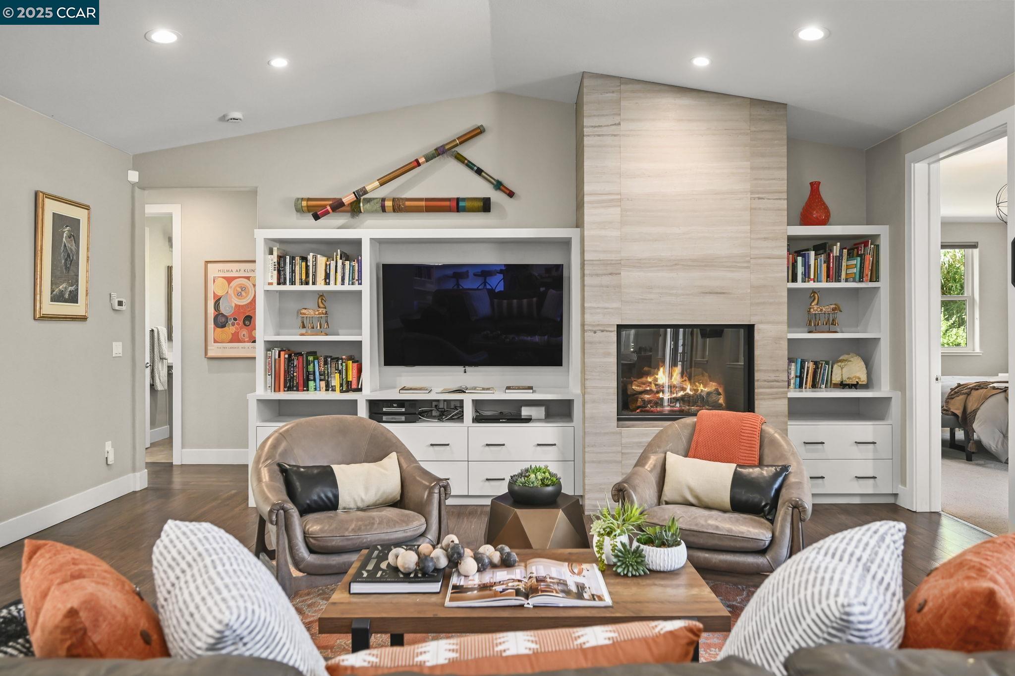 1096 Mountain View Boulevard Walnut Creek, CA 94596 - Photo 6 of 49 a living room with furniture a flat screen tv and a fireplace